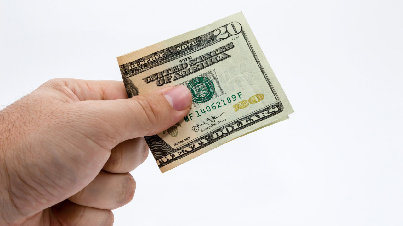 Adobe Stock - Hand holding $20 Bill