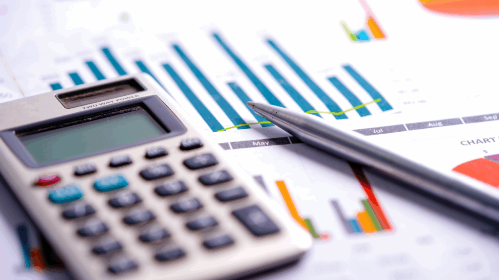 Adobe Stock - Calculator, Pen and Finance graphs